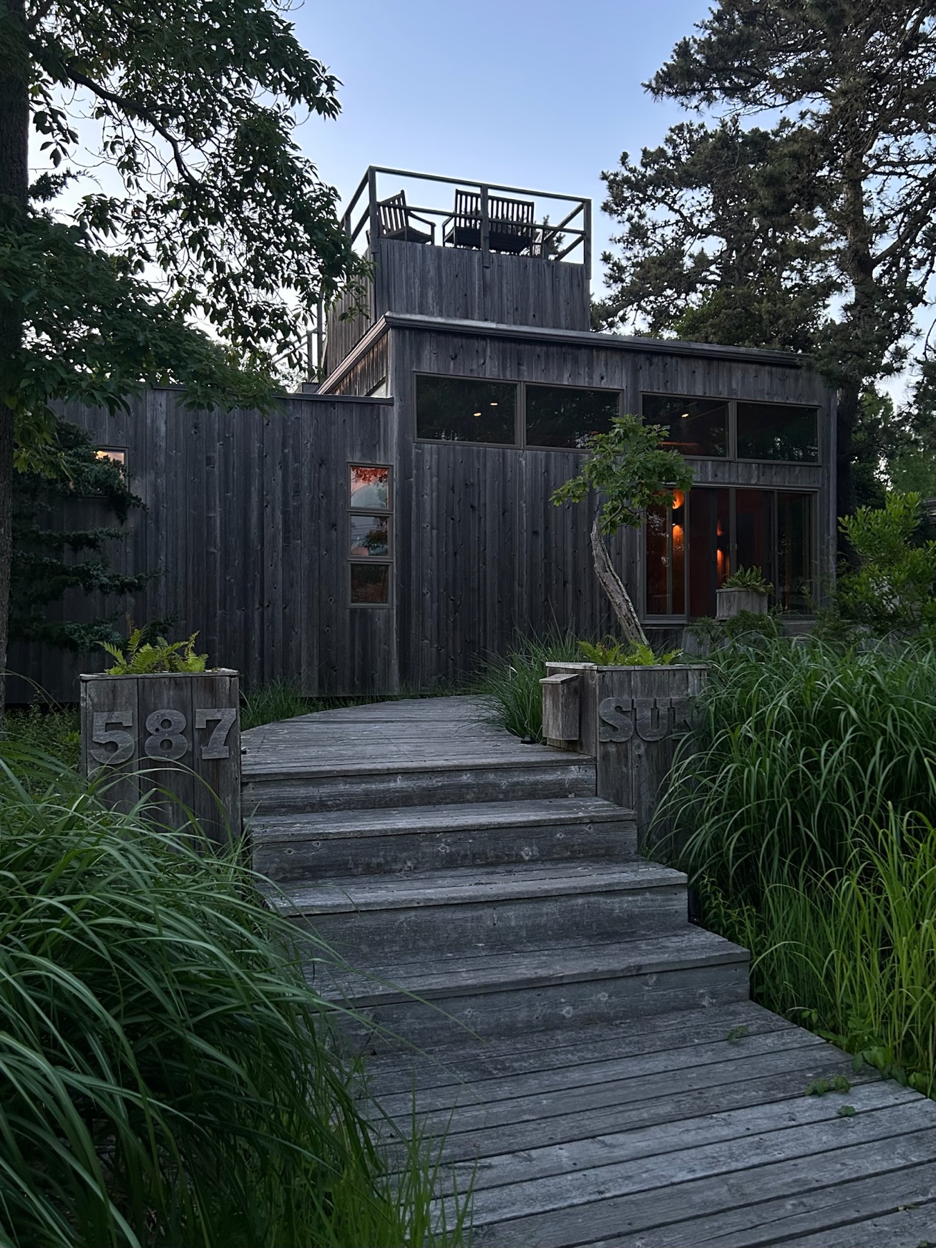 Front entrance at dusk, view down Sun Walk