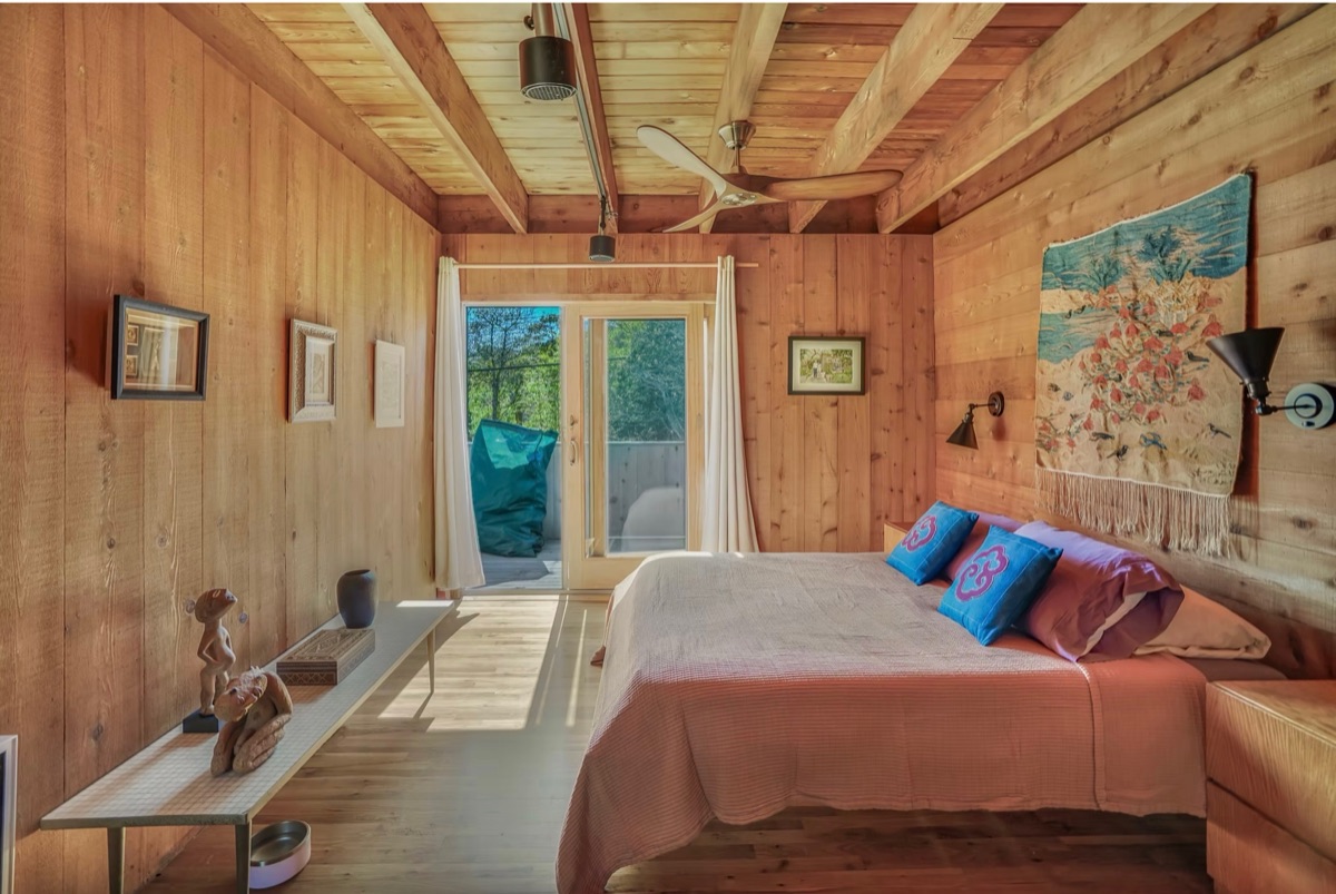 Primary bedroom with woven tapestry