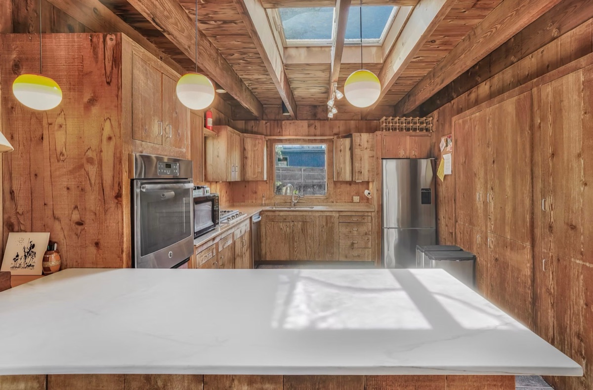 Kitchen with skylight and pendant lighting